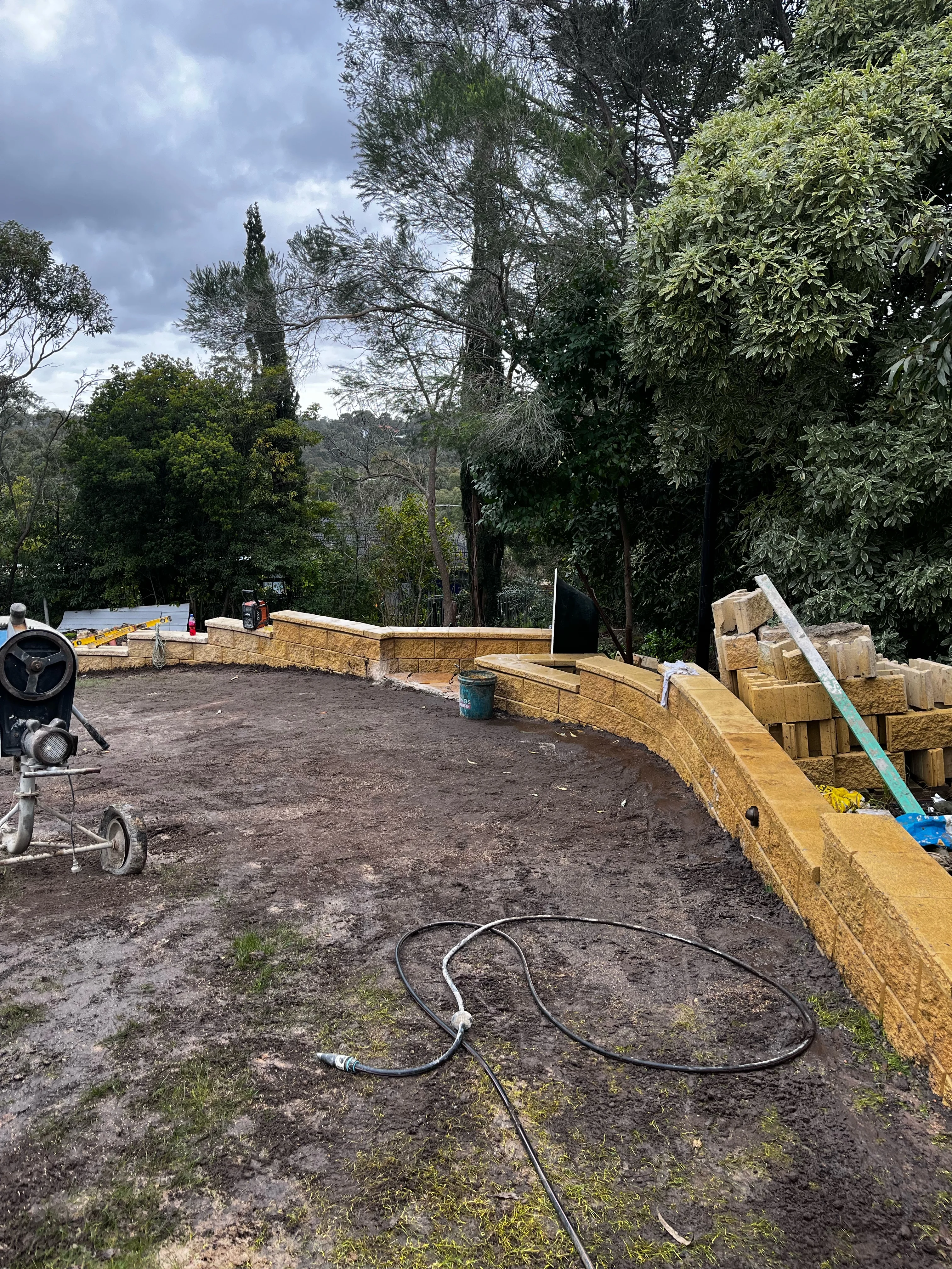 Terraced lawn, sleeper walls and ground grid before