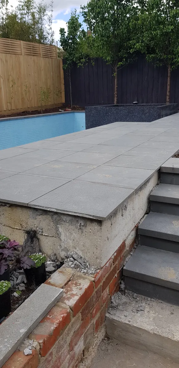 Paved steps at the pool edge