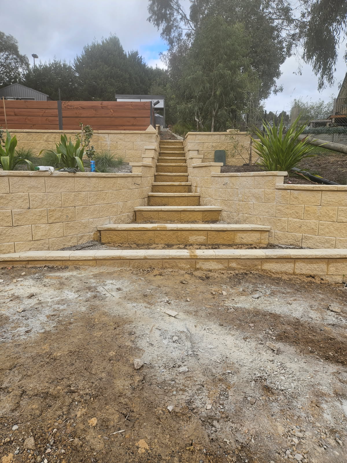 Stone retaining wall with steps leading up